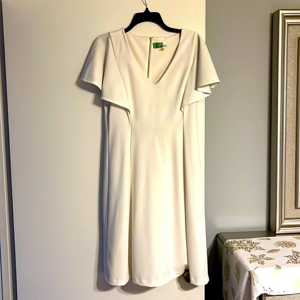 Cream V-neck Calvin Klein size 10 flare on the shoulder A-line dress.